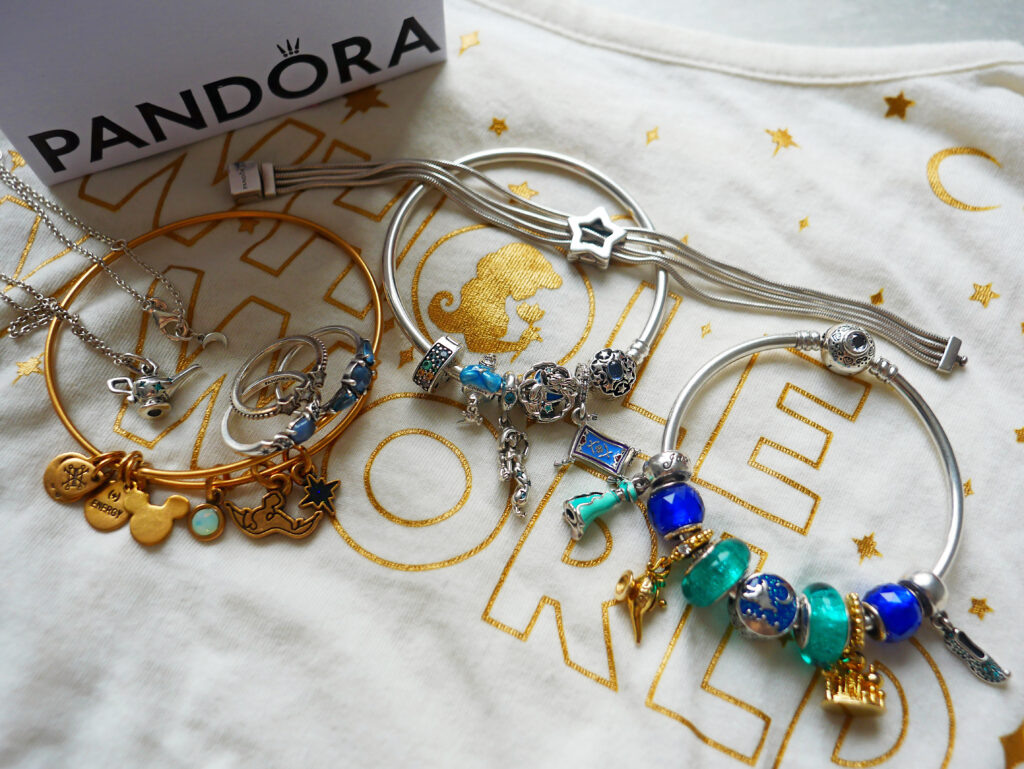 Disney Aladdin beetle 14k gold-plated dangle with clear cubic zirconia and  transparent aquatic blue enamel | PANDORA